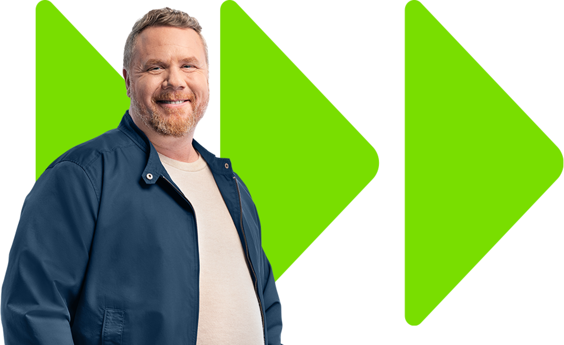 Man smiling in front of a green arrow background